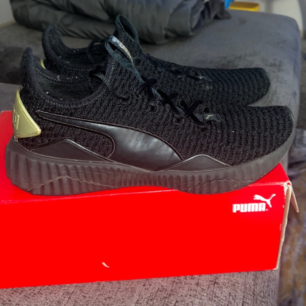 Puma Black-Metallic Gold Defy Varsity Women’s shoes